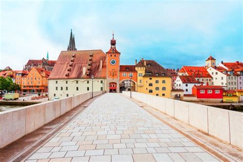 Premium Photo | Stone bridge and old city gate with bridge tower or ...