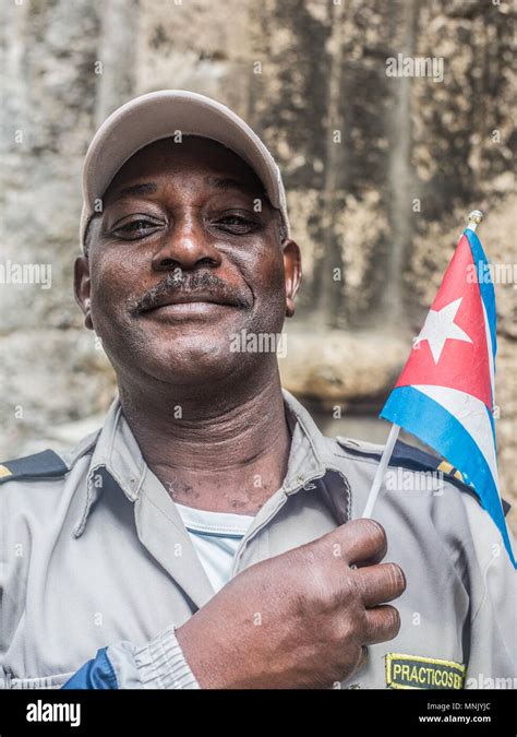 Cuban Military Man Holding Cuban Flag Stock Photo Alamy