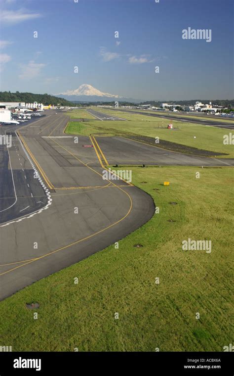 Aerial View Of Landing Strip At King County Airport Boeing Field With Mt Rainier In The