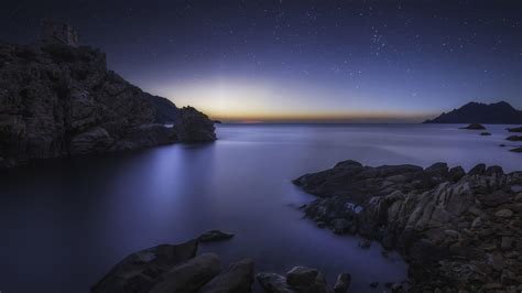 Rocky Seashore At Night Wallpaper Backiee