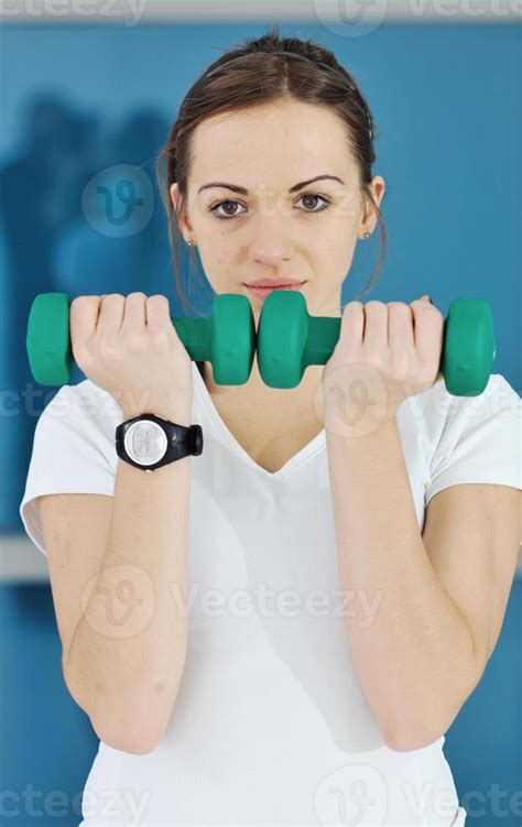 woman fitness workout with weights 10977294 Stock Photo at Vecteezy