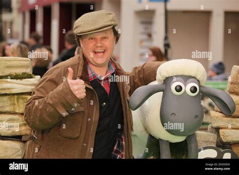 Tv Presenter Justin Fletcher Poses For Photographers On Arrival At The