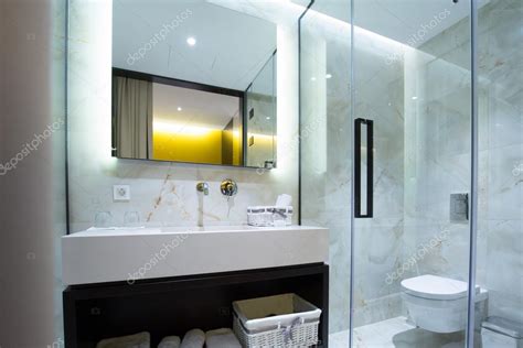 Modern luxury hotel bathroom interior Stock Photo by ©rilueda 119501836