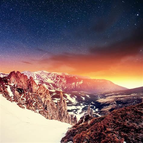 Premium Photo Fantastic Winter Meteor Shower And The Snowcapped Mountains