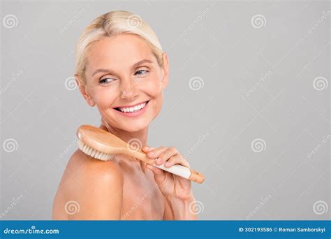 Photo Of Charming Pretty Senior Lady Nude Shoulders Doing Peeling Brush