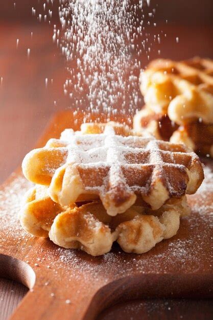 Premium Photo Belgian Waffles Sprinkled With Icing Sugar