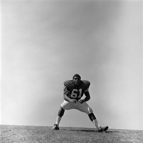 Football Player 61 Glen Holloway Paused In A Wide Stance Unt