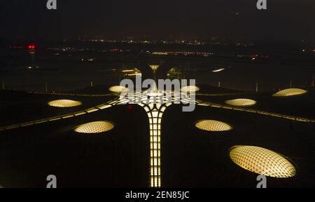 The Beijing Daxing International Airport is illuminated by light projections at night in Beijing ...