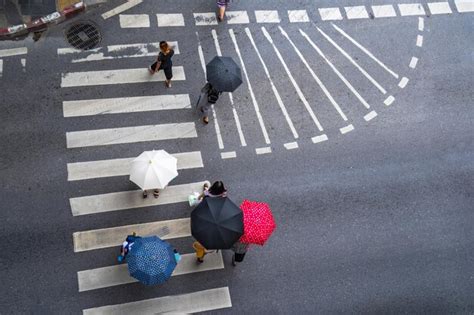 Premium Photo High Angle View Of People Walking On Road