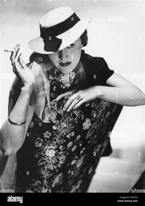 Woman smoking cigarette historical Black and White Stock Photos ...