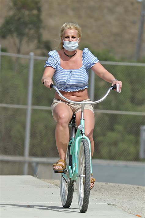 Britney Spears on a bicycle with a face mask on | Lipstick Alley