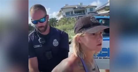 Woman Handcuffed And Escorted Off Public Beach By Police Over Her Bikini Choice
