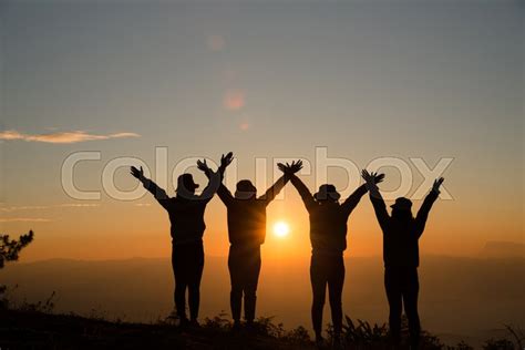 Group of friends standing together on ... | Stock image | Colourbox