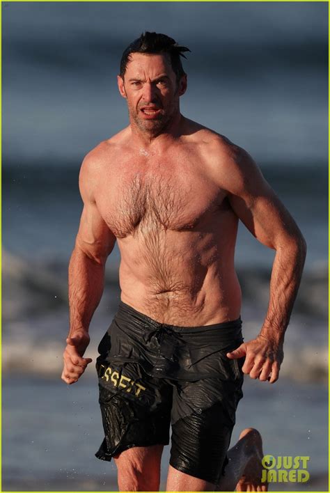 Hugh Jackman Runs Shirtless On The Beach With His Ripped Muscles On