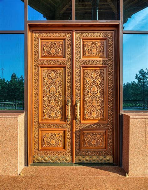 Carved Wooden Doors With Gilded Metal Handles Stock Photo Image Of