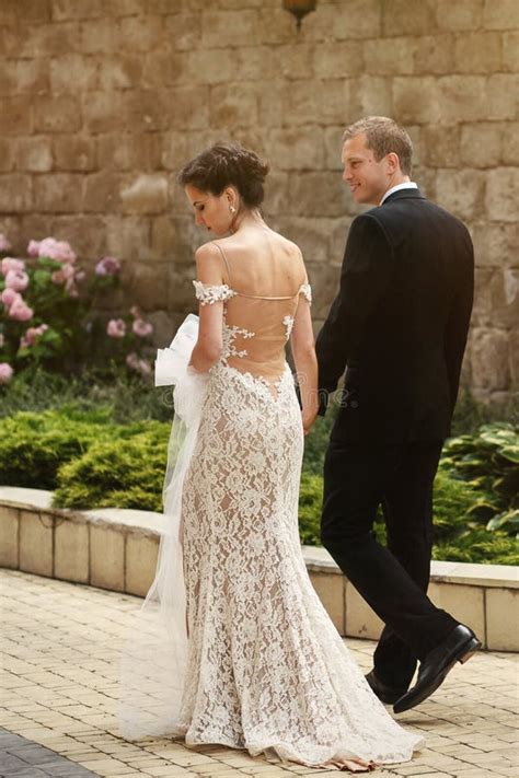 Gorgeous Brunette Sexual Bride Walking With Handsome Groom In Ca Stock Image Image Of Holding
