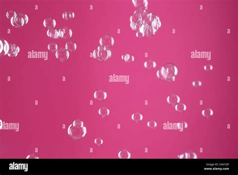 Beautiful Transparent Soap Bubbles On Pink Background Stock Photo Alamy