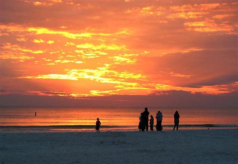 Sunsets Free Stock Photo People Watching The Sunset On A Beach 9917