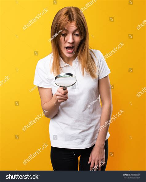 Surprised Beautiful Young Girl Magnifying Glass Stock Photo 721197061