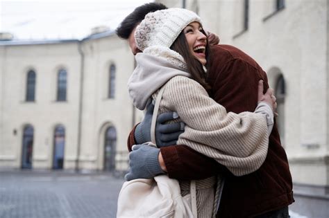 Free Photo Friends Reuniting And Hugging After Not Seeing Each Other