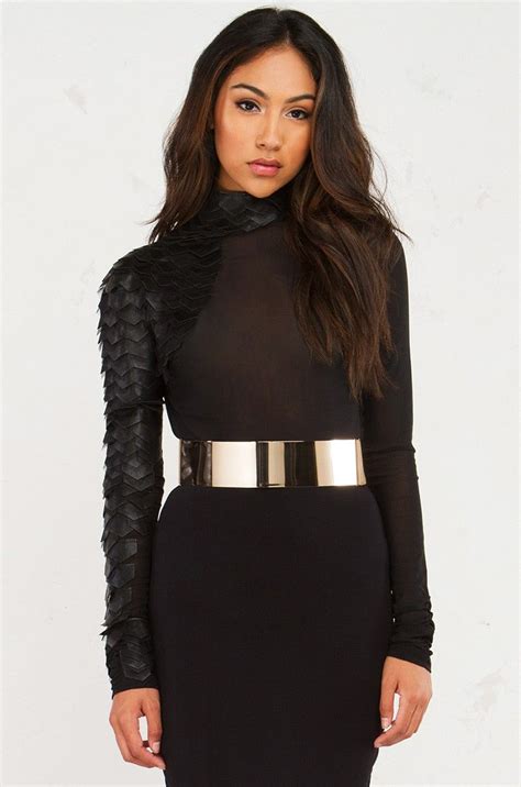 Front View Of Sheer Turtleneck Long Sleeve Top With Faux Leather Scales Up The Right Arm