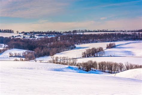 View Of Farms And Snow Covered Rolling Hills In Rural York Count Stock