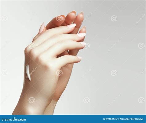 Woman Hand With Cream Closeup Portrait Of Beautiful Happy Girl With Nude Makeup And Natural