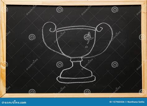 Write Trophy Symbol On Blackboard With Chalk Trophy Is A Tangible