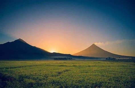 Mayon Volcano And Mount Masaraga Side By Sideexposing A Dramatic Scene