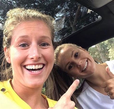 Two Women In A Car Giving The Thumbs Up Sign