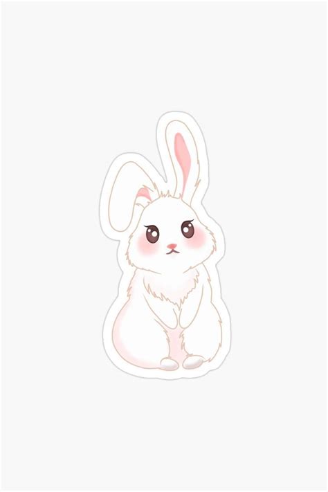 A White Rabbit Sticker With Pink Ears Sitting On The Ground And Looking