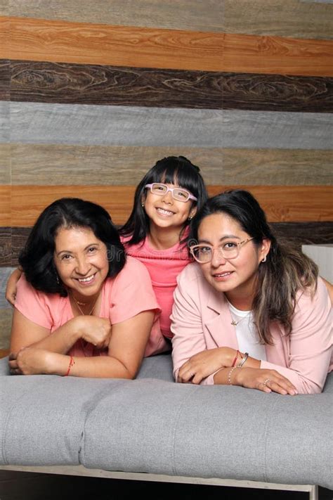 Latina Grandmother Mom And Daughter With Eyeglasses Spend Quality Time Show Their Love And