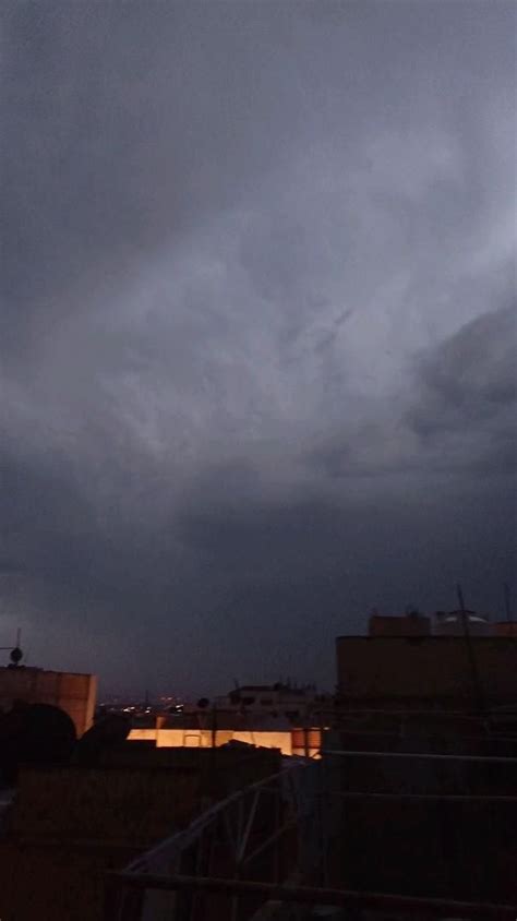 Night Sky With Dark Clouds And Buildings