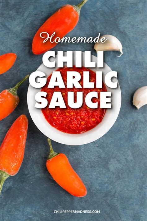 Homemade Chili Garlic Sauce In A White Bowl Surrounded By Peppers And