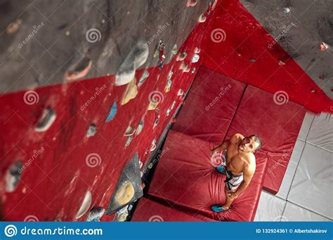 Panoramic Man Bouldering At An Indoor Climbing Centre Stock Image