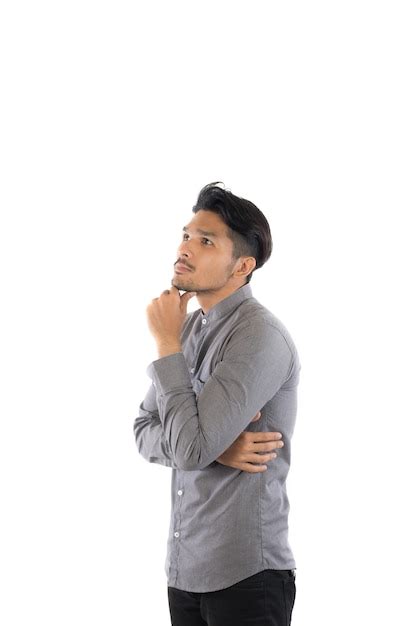 Premium Photo Man Wearing Gray Shirt Standing Against White Background