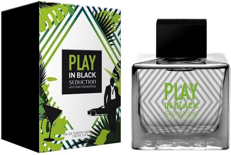 A Bottle Of Play In Black Cologne Next To A Box