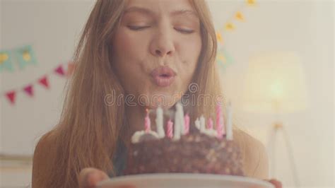 Happy Birthday To Me Young Cheerful Woman Blowing Up Candles On Her