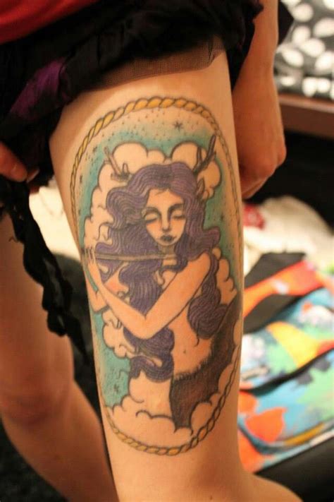 a woman with a tattoo on her leg