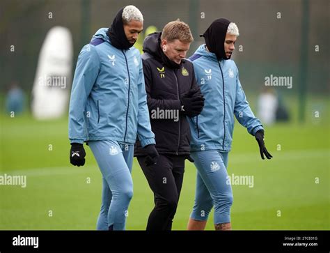 Newcastle United Manager Eddie Howe With Bruno Guimaraes Right And Joelinton Left During A