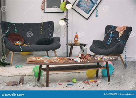 Messy living room interior stock photo. Image of apartment - 142558802