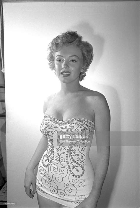 Marilyn Monroe Poses For A Portrait In A Bathing Suit In February 1952