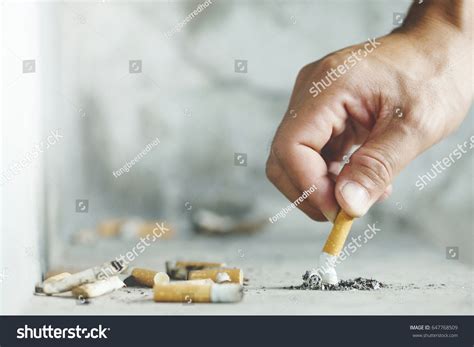 Hand Putting Out Cigarettecigarette Butt On Stock Photo