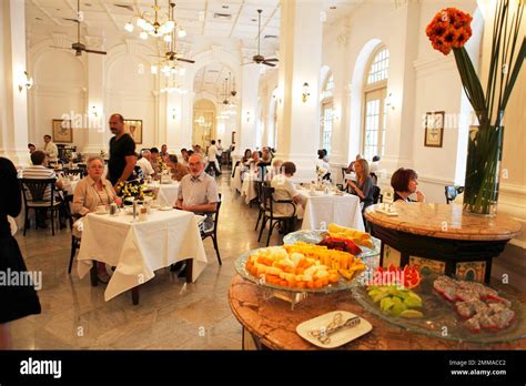 People at High Tea in the Grand Lobby, Raffles Hotel, Singapore Stock ...