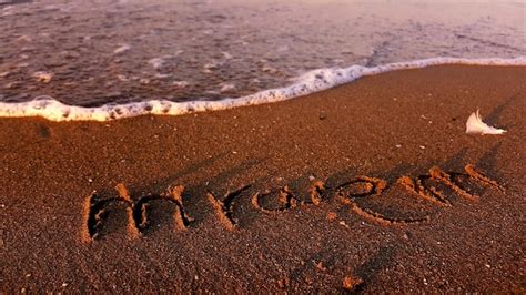 Premium Photo Text On Sand At Beach