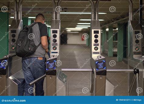 New York City Mta Subway Station Person Walking Through Turnstile With