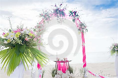 Wedding Arch Decorated With Flowers On Tropical Beach Outd Stock Image