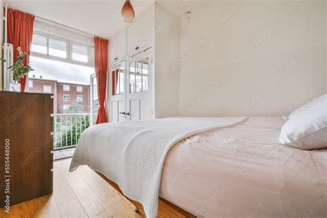 Stylish bedroom interior with balcony Stock Photo | Adobe Stock