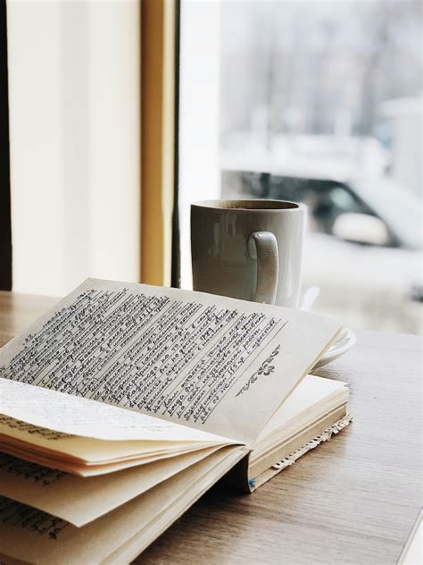 Gray Ceramic Mug on top of Book · Free Stock Photo