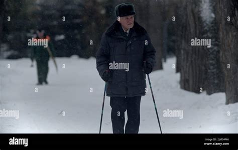 Elderly Grandfather Old Grandfather Doing Hiking In Winter Time In